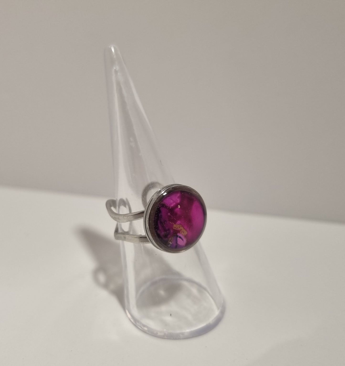 Adjustable ring with resin finish